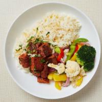 Paleo Meatball Rice Bowl · Cauliflower rice, spicy lamb meatballs and roasted seasonal vegetables (bell peppers, brocco...