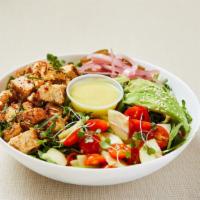 Paleo Chicken Salad · Mixed green salad (arugula, spinach, lettuce) served with seasoned chicken bites, grape toma...