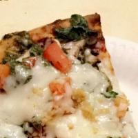 The Haight Pizza · Pesto, Spinach, Mushroom, Tomato, Garlic, Fresh Parmesan.