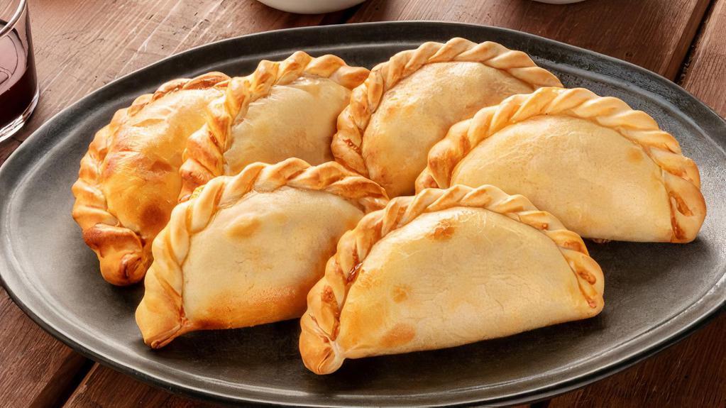 Empanadas · Fried corn dough, filled with customer's choice of filling. Served with tomato sauce and marinated cabbage.