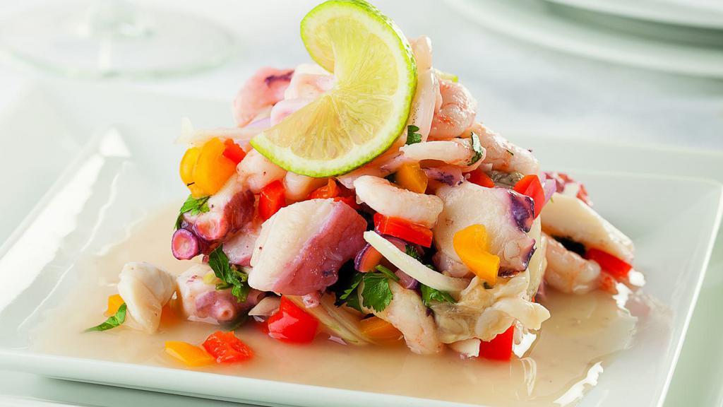 Ceviche · A perfectly seasoned ceviche made with Shrimp, Swai fish, onions, tomatoes, cilantro, lime juice, habanero, avocado and tortilla chips.