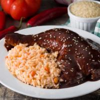 Chicken Mole · A delightful entrée of seasoned Chicken topped with a Mexican chocolate sauce and served wit...