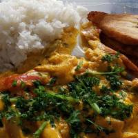 Moqueca Peixe · Coconut milk stew with grilled codfish, onion, pepper, palm oil, jalapenio and cilantro. Ser...