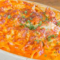 Penne al Forno · Small tube pasta baked home-style with a hearty meat sauce smothered in melted cheese.