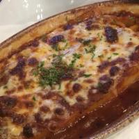 Lasagna Della Casa · Layered pasta with meat and Italian cheeses, baked in red meat sauce and topped with mozzare...