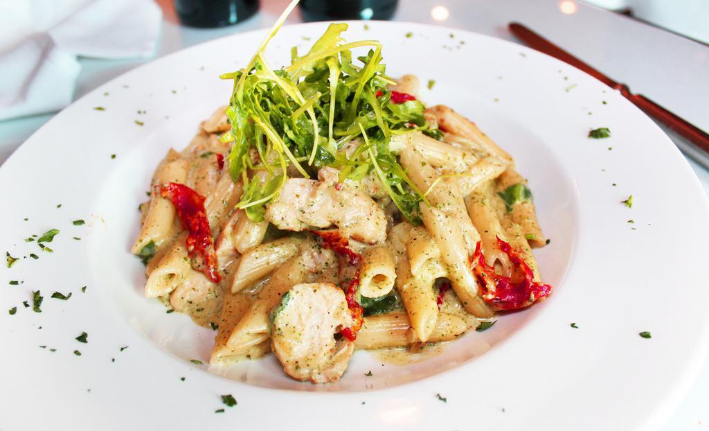 Penne Pesto · Grilled chicken, roasted tomatoes and spinach in a creamy pesto sauce.