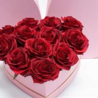 heart shape box of roses · One dozen roses inside a heart shape box comes in pink or black box