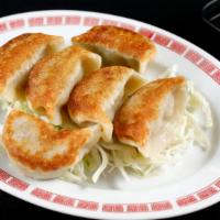 Pot Stickers · Crispy pork & cabbage dumplings served with ginger & black vinegar.