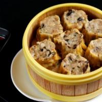 Cilantro Mushroom Chicken Sui Mai Dumplings · Served with ginger and red vinegar.