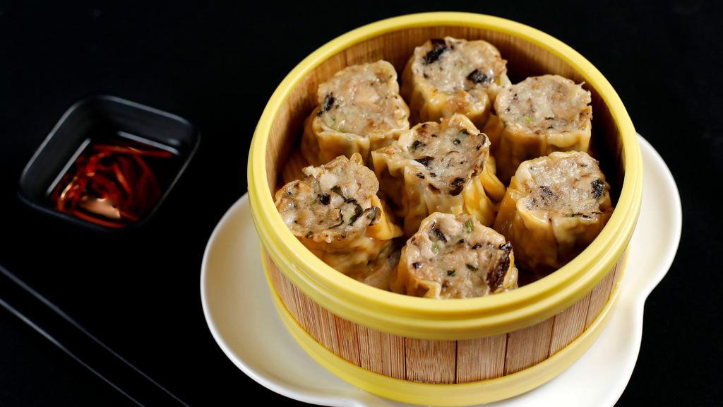 Cilantro Mushroom Chicken Sui Mai Dumplings · Served with ginger and red vinegar.