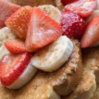 A7 Strawberry & Banana Pancakes · Two buttermilk pancakes topped with fresh strawberries, bananas & sprinkled with powdered su...