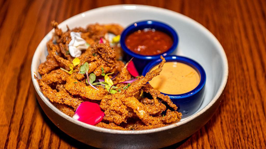Classic Fried Calamari · lightly battered and fried Pacific catch squid, served with traditional cocktail marinara sauce and chipotle aioli
