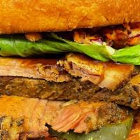 Brisket Sandwich · Smoked brisket, pickles, lettuce, coleslaw, on a brioche bun and fries
