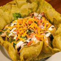 Crispy Taco Bowl · flour spinach tortilla bowl, Mexican rice, chopped romaine lettuce, grilled chicken, pico de...