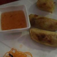 Spring Roll · Stuffed with glass noodle, cabbage, carrot, and celery. Served with plum dipping sauce.