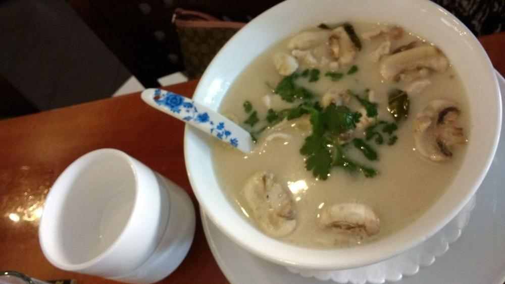 18. Tom Kha Soup · A tasty soup with chili paste, carrots, coconut milk, mushrooms, lemongrass, galangal, kaffir lime leaves, lime juice, baby corn, and cilantro.
