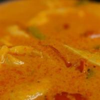 Ls13. Red Curry · Spicy. Bamboo shoot, basil, and bell pepper in coconut milk with red curry paste.