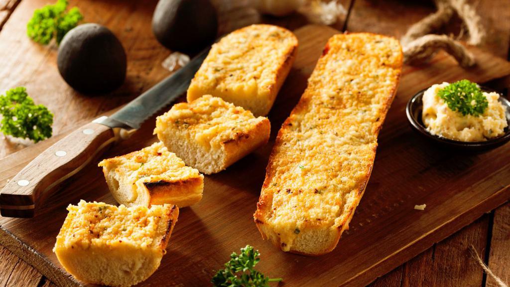 Crispy Garlic Bread · Fresh crispy French bread smothered in garlic.
