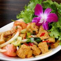 Tofu Salad · Fried tofu with red and green onions, shrimp paste in lime dressing.