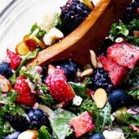Kale Berry Chicken Salad · Grilled chicken breast served over a bed of kale, topped with blueberries & strawberries, pe...