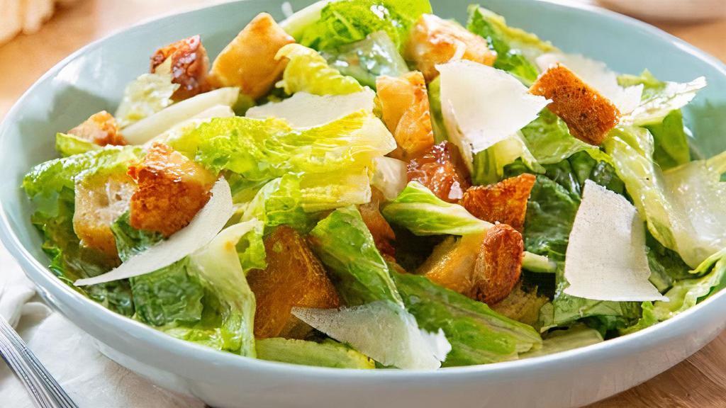 Side Dinner Caesar Salad · Romaine lettuce, parmesan cheese, Caesar dressing & croutons.