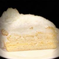 Lemon Coconut Cake slice · white cake, lemon custard, buttercream frosting