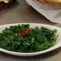 Kale Green Saag · Fresh kale sautéed with garlic, ginger and soy sauce.