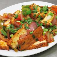 Tofu Chili · Vegan. Tofu, cauliflower, mushroom, broccoli, spinach, potatoes, sautéed with red and green ...
