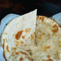 Butter Naan · Made from fresh dough topped with butter, clay oven baked naan bread.