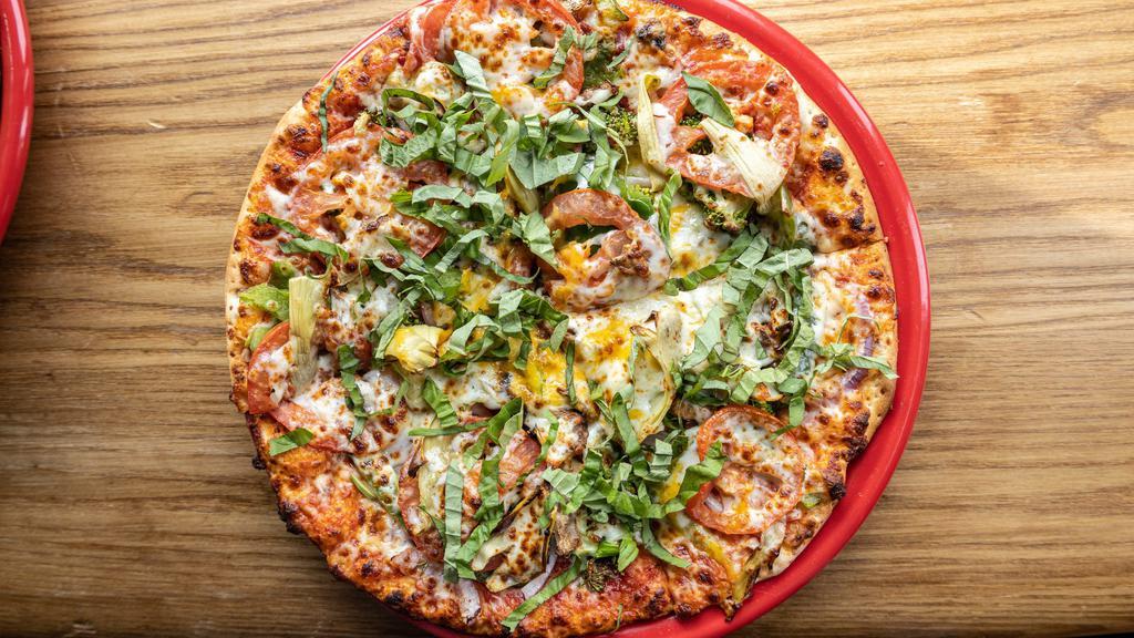 Drag It Thru The Garden · Our garden (basil) is topped with artichokes, basil, broccoli, cheddar, green peppers, mozzarella, mushrooms, red onions, tomatoes, tomato sauce.