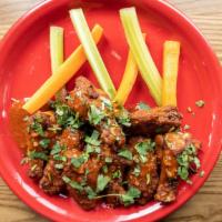 Original Buffalo Wings · Buffalo flavor only. Choice of ranch or bleu cheese served with carrot sticks and celery.