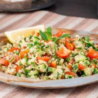 Vegan Tabbouleh Salad · Cracked wheat, diced vine ripe tomatoes, cucumbers, scallions, fresh herbs, lemon juice and ...