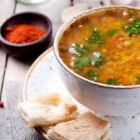 Lentil Soup · With pita bread. Hearty greens, mixed with fresh potatoes, flavorful spices, and a hint of l...