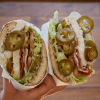 Chicken Bacon Jalapeño Sandwich · A Hot, Gooey, Spicy Fave!. Toasted Soft Roll, Hot Chicken Breast, Bacon, Melted Pepperjack C...