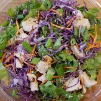 Asian Chicken Salad · Crunchy Romaine and Red Cabbage, Cucumbers, Green Onions and Sesame Seeds. With our House-Ma...