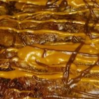 5. Jumbo Brownies · Jumbo chocolate gooey brownies. With chocolate and caramel drizzle