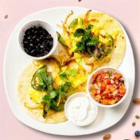Jolly Rancheros (Huevos) · Lightly fried eggs served on a warm tortilla and topped with salsa, tomatoes, chili peppers,...