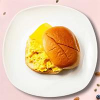 Lay an Egg and Cheese Sandwich · Scrambled egg, cheddar cheese, sliced tomato and caramelized onions served.
