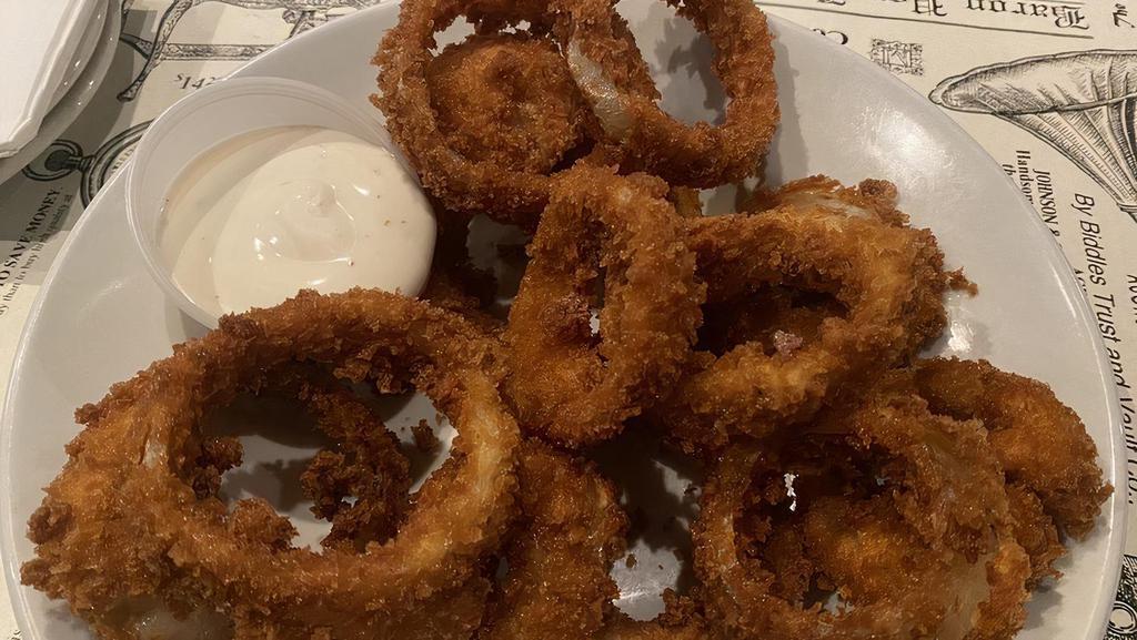 Onion Rings · Thick onion slices, beer battered and drizzled with gorgonzola dressing.