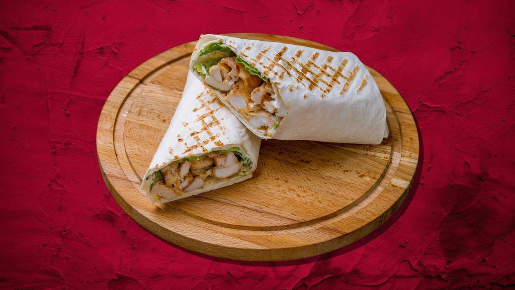 Classic Chicken Gyro Wrap · Char-grilled chicken gyro meat wrapped to perfection with fresh veggies. Comes with white sauce and ketchup.