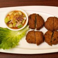 Fishcake · Mince fish with sliced green bean, kaffir lime leaf and touch of Thai red curry paste, deep ...