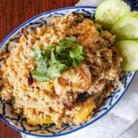 Pineapple Fried Rice · Chicken, prawns, pineapples, green peas, tomatoes, onions, shrimp paste, egg, cashew nut and...