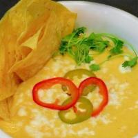QUESO E' TORTILLAS · Housemade Warm Cheese Dip with Spiced Chips