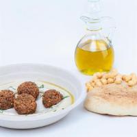 Hummus Falafel · Hummus topped with 4 Falafel balls, olive oil, and freshley chopped parsley.