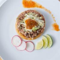 Sopes (1 Pcs) · Refried beans, lettuce,tomato,onion, cotija cheese and tomato sauce.