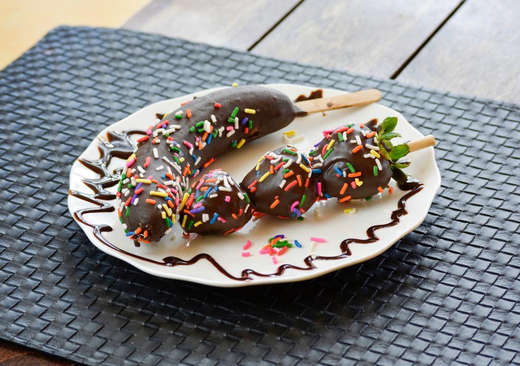 Chobanana · A banana dipped in chocolate, topped with sprinkles.