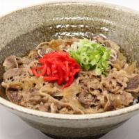 Beef Donburi · Sweet and tender beef, onions over rice with benishouga and green onions.