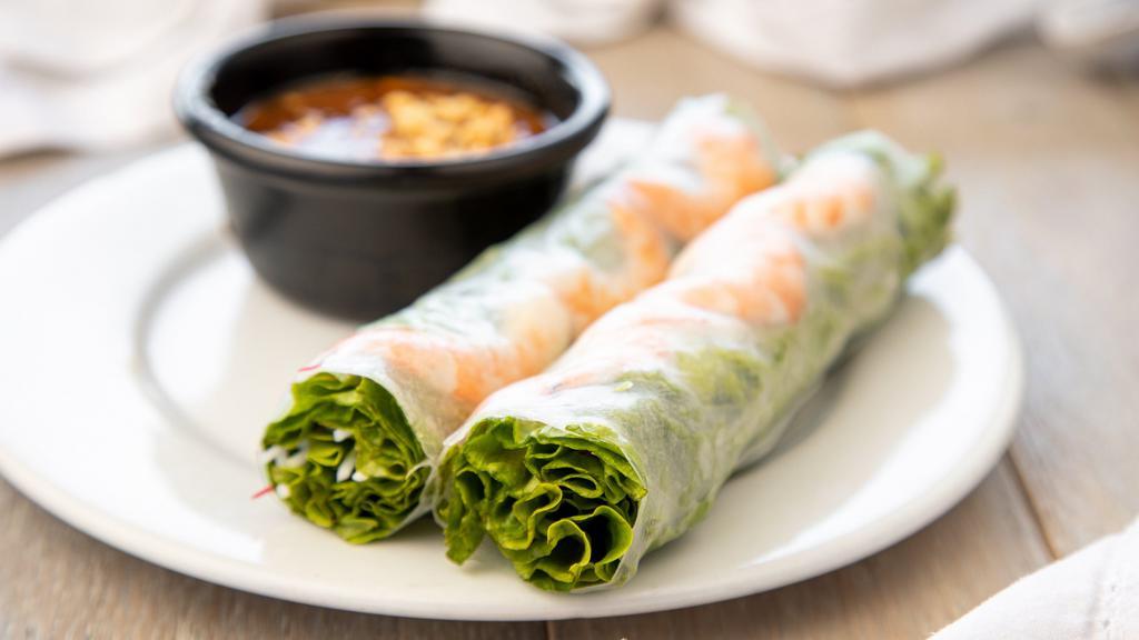 1. Goi Cuon (2 Rolls) · Fresh Shrimp Lettuce Spring Rolls:
Steamed shrimp wrapped in rice paper with vermicelli, lettuce, and bean sprouts served with peanut sauce .