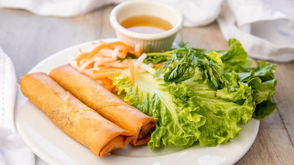2. Cha Gio (2 Rolls) · Deep Fried Egg Rolls:
Crispy rice paper rolls filled with pork, wood ear mushroom, clear vermicelli, and vegetables. Served with Asian green and fish sauce.