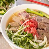 15. Pho Dac Biet Soup · Rice noodle soup with rare beef, well done beef, and meatballs, tendon, and tripe.